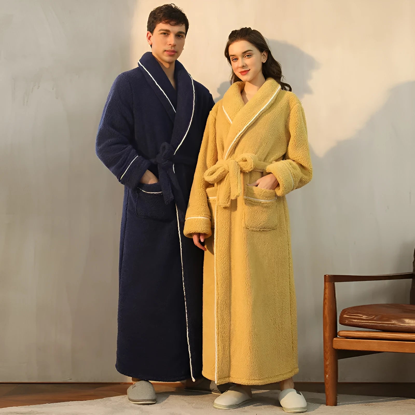 A man and woman wearing matching thickened flannel couple's bathrobes in a winter colour.