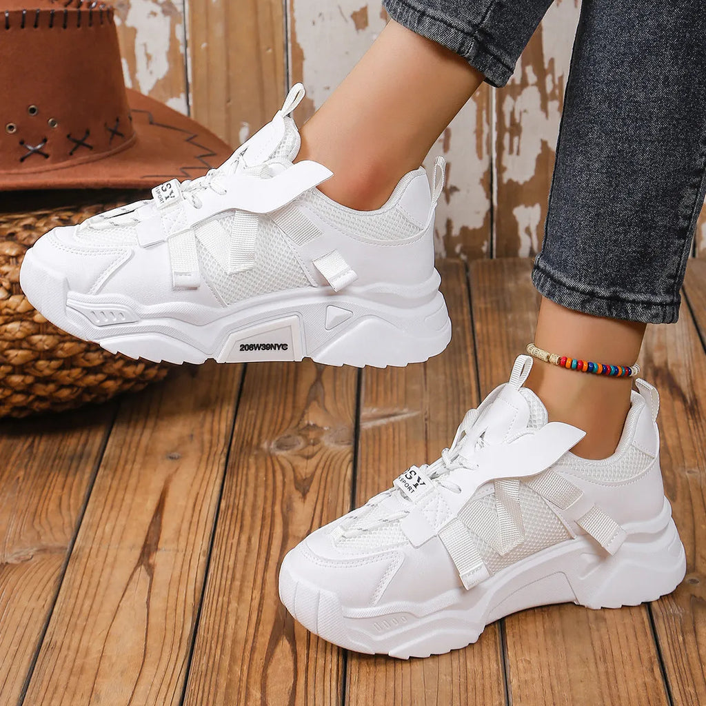 Women's platform sneakers in purple with mesh upper, animal pattern detail, and lace-up front.
