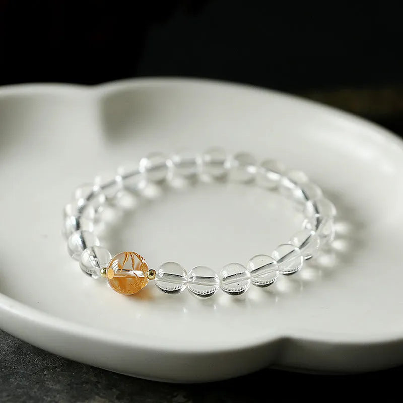 Geometric obsidian and white crystal beaded bracelet with golden dragon charm on adjustable band