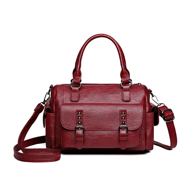 Vintage messenger bag in horizontal square shape showing stitching details and shoulder strap