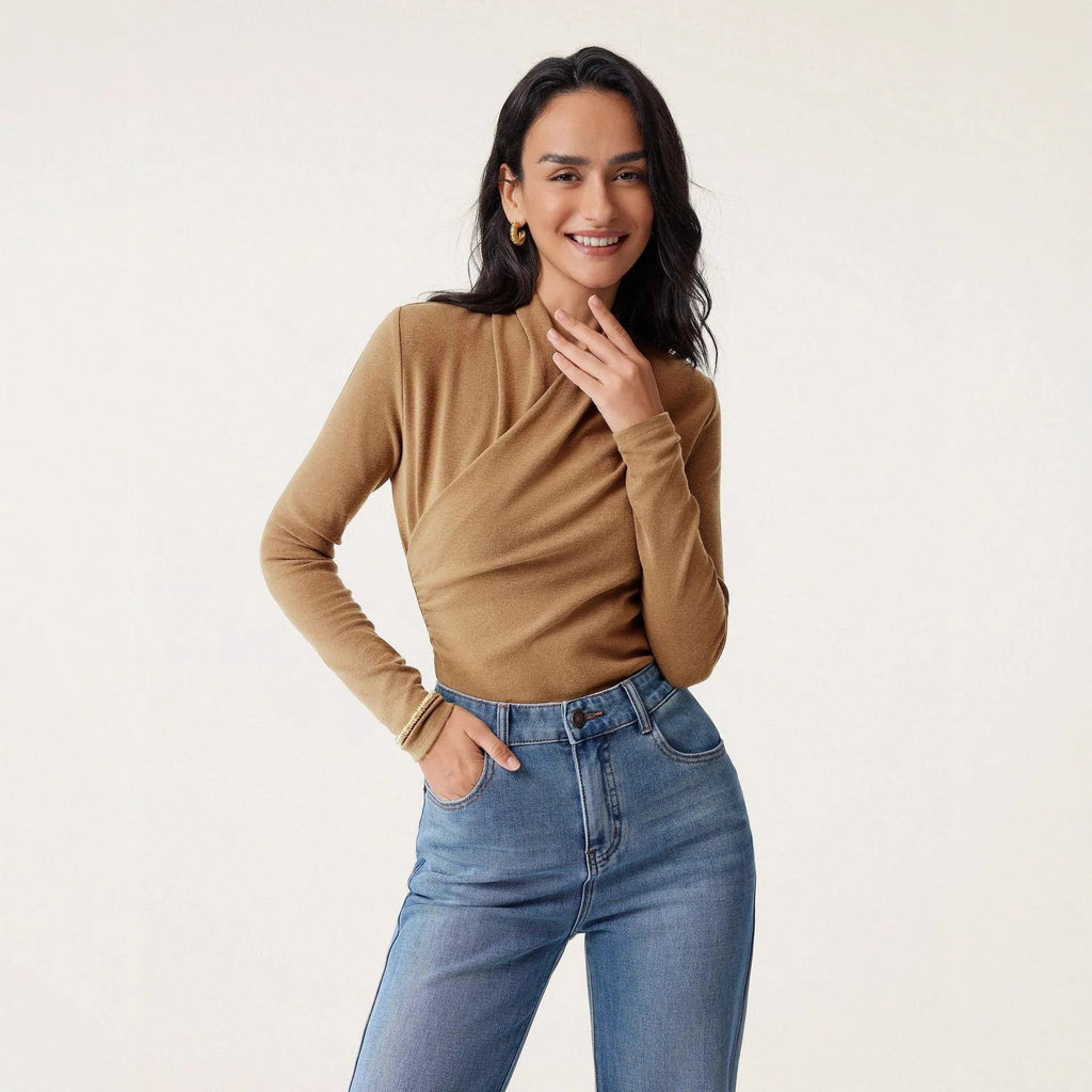 Camel coloured women's slim fit long sleeve pullover sweater on a hanger.