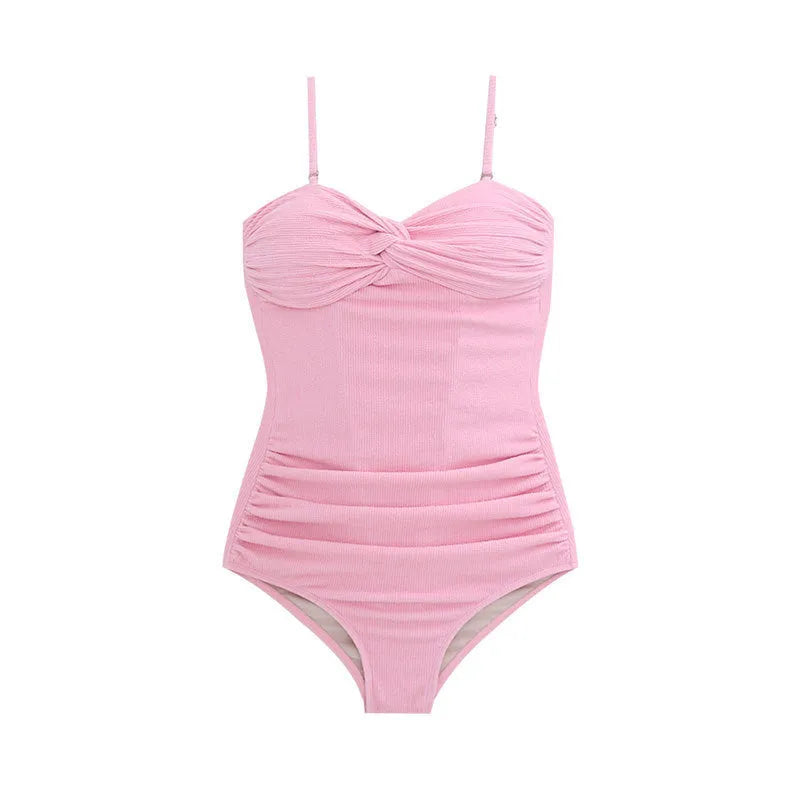 Women's black suspender strap one-piece swimsuit with a high-waisted slimming design on a mannequin.