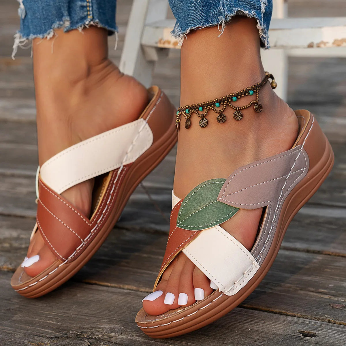 Women's red-brown cork wedge sandals with leaf design and gladiator lace-up ankle strap