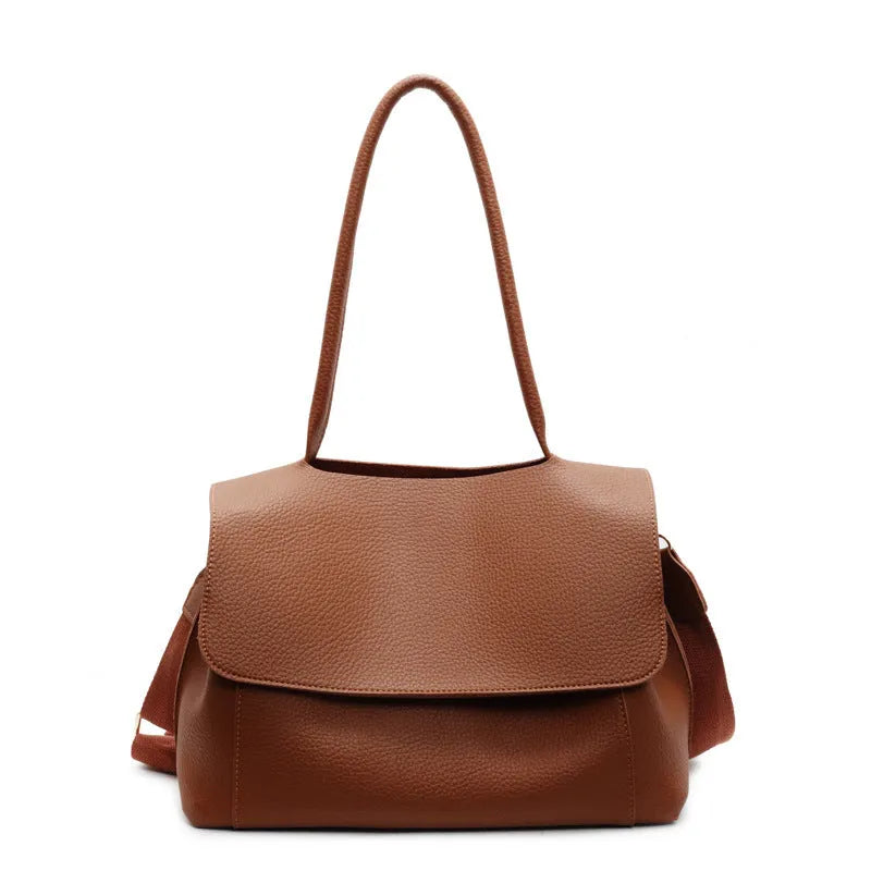 PU leather tote bag in beige with double shoulder strap and visible stitching detail.