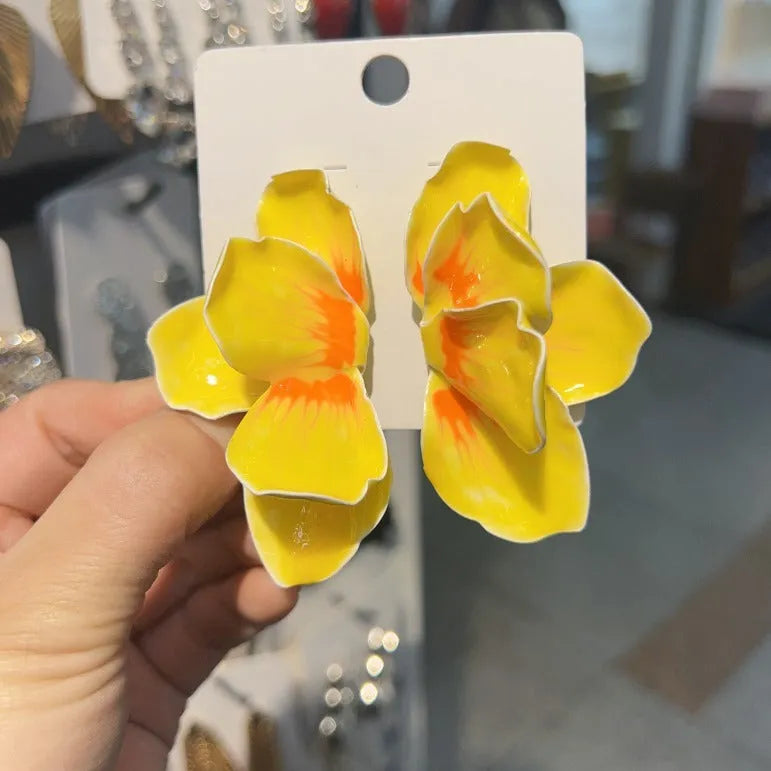 A pair of pastoral style alloy stud earrings with oil-spot glaze floral design in one of four colours.