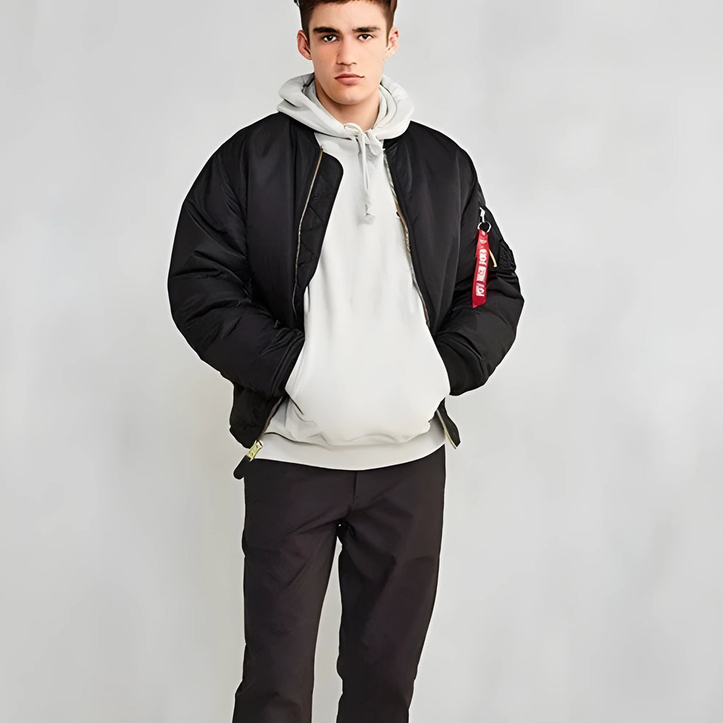 Men's loose fit cotton-padded nylon pilot jacket in army green on a hanger.