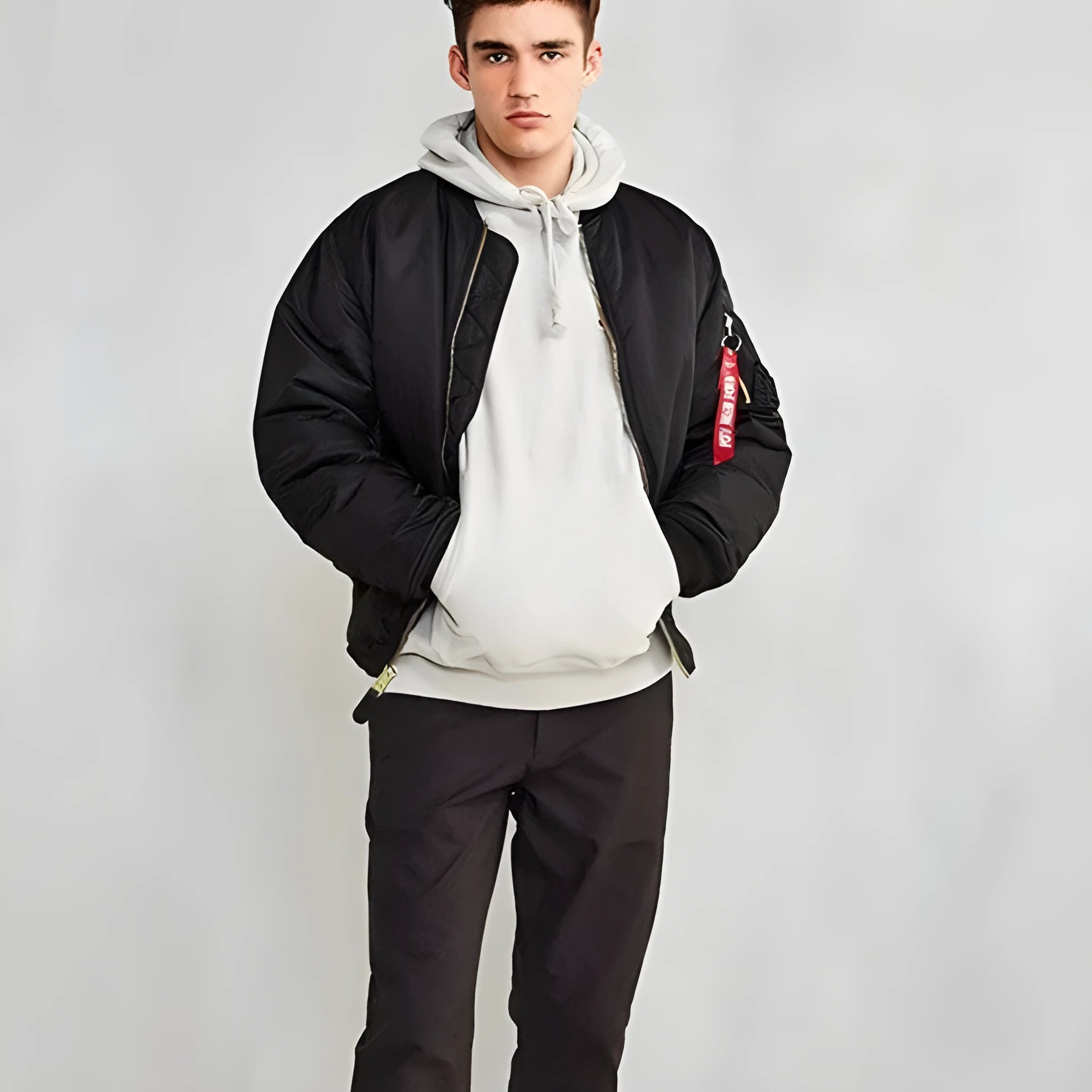 Men's loose fit cotton-padded nylon pilot jacket in army green on a hanger.