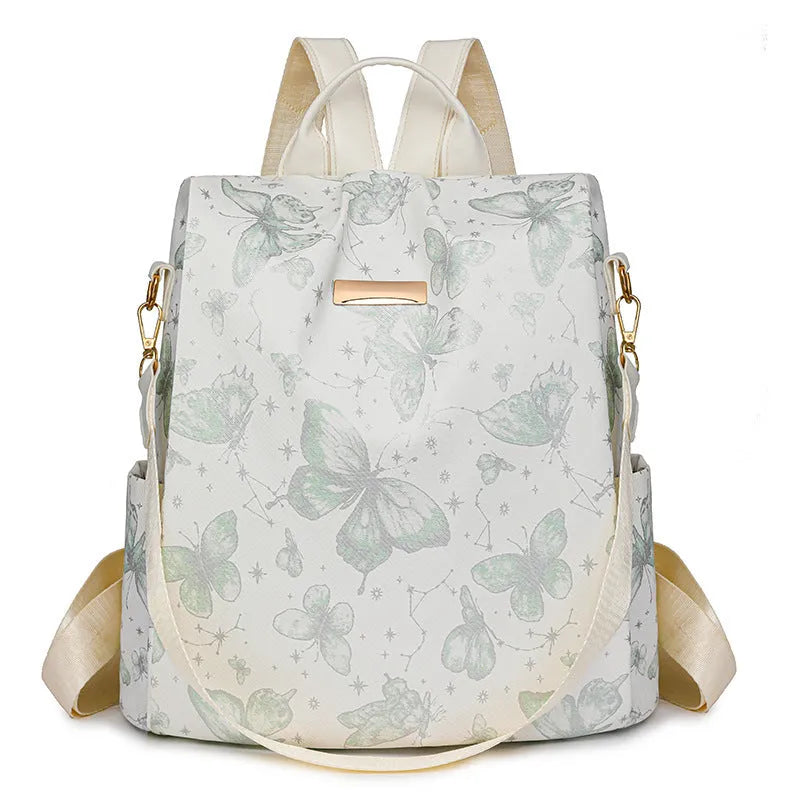 Butterfly printed PU backpack in multiple colours showing sewing line detail and curved backplate