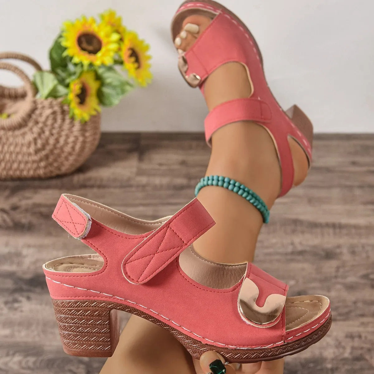 Light brown Velcro-strap Roman sandals with round toe and rubber sole on a white background.