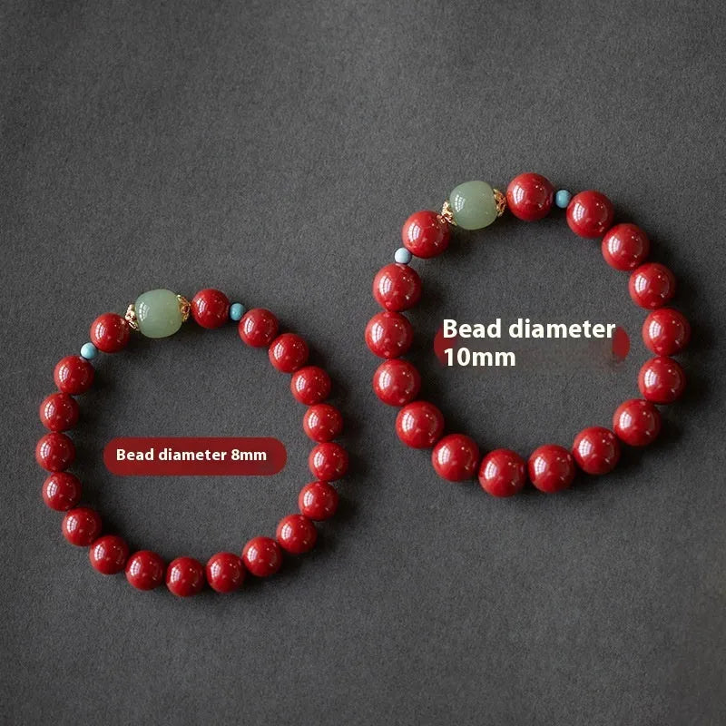 Cinnabar and coated metal geometric bracelet with elliptical beads in purple gold sand colour.