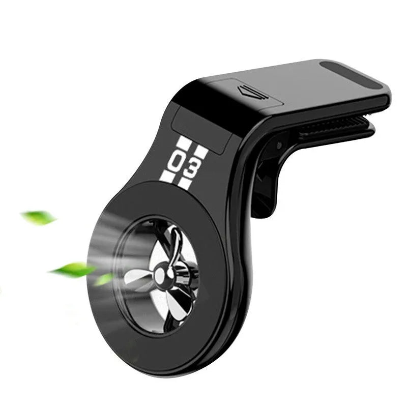 Black universal magnetic car phone holder clipped to a car air vent, holding a smartphone.