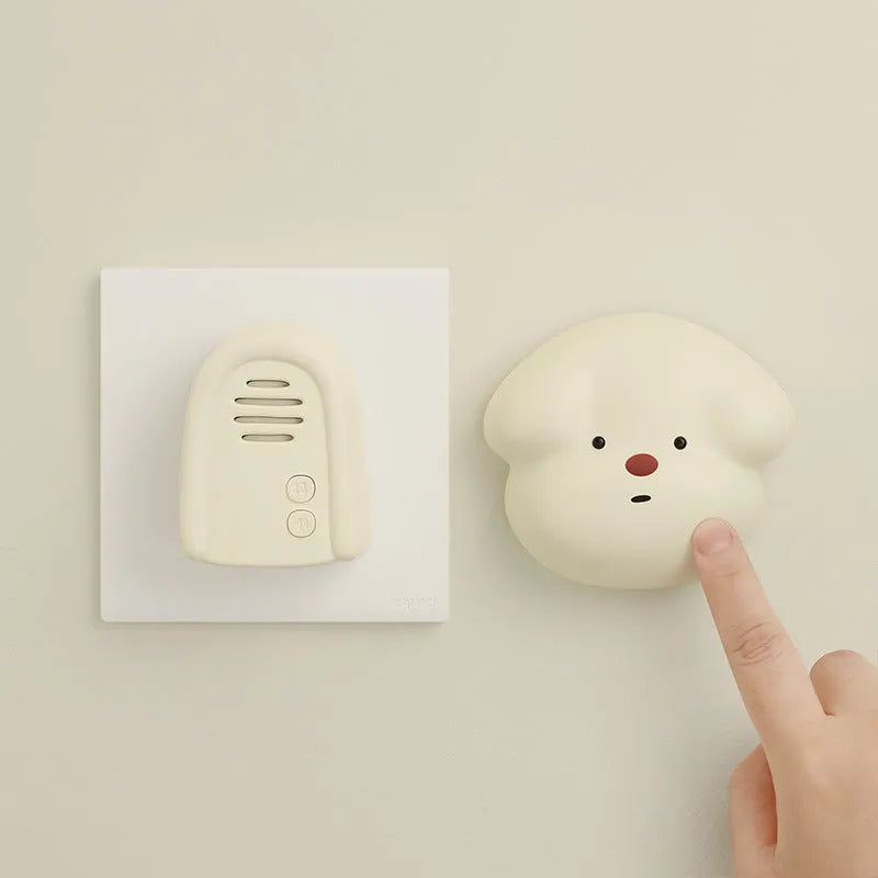 Wireless plug-in doorbell in milky yellow or white for household entryway use