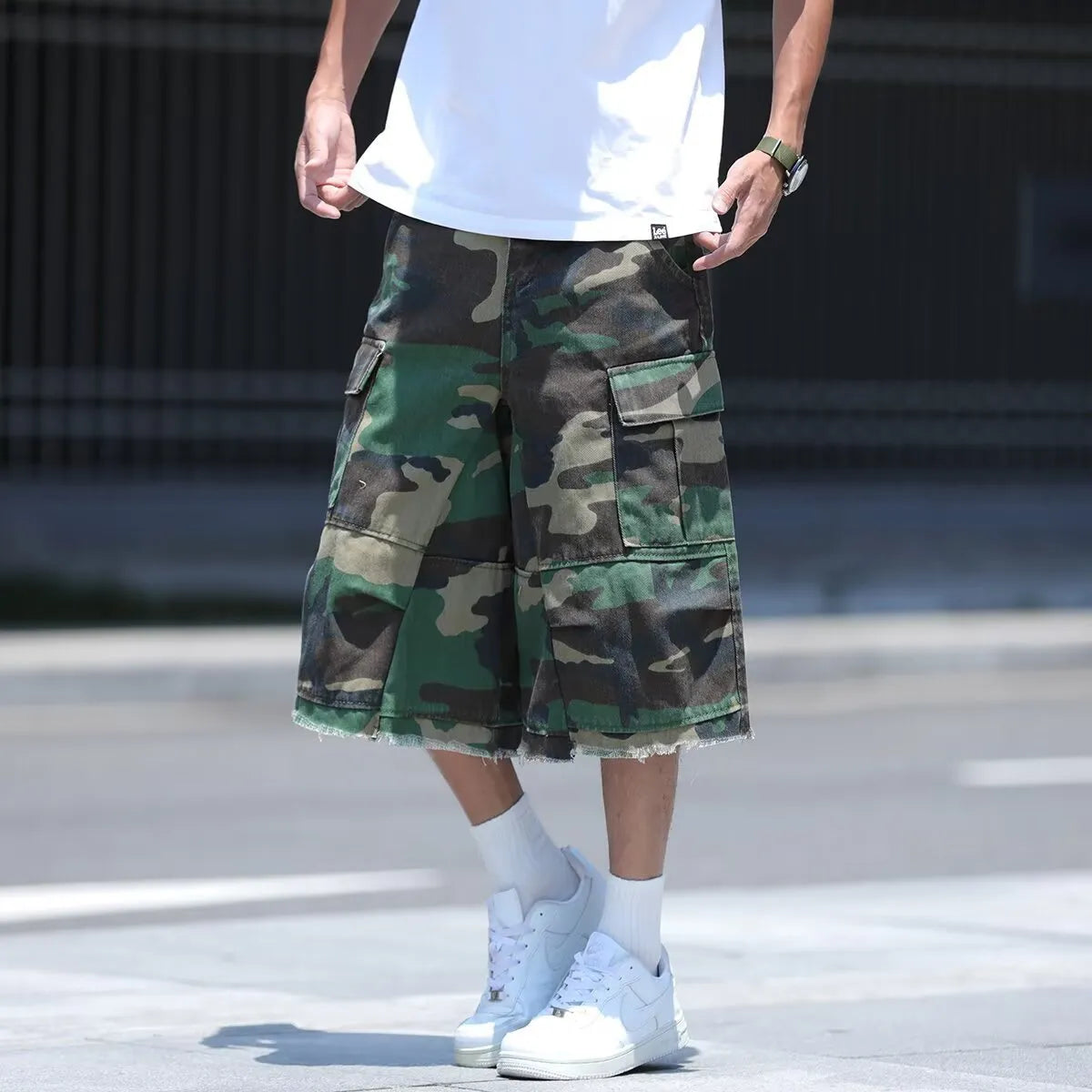 Men's camouflage pattern shorts with retro workwear styling and loose cropped fit