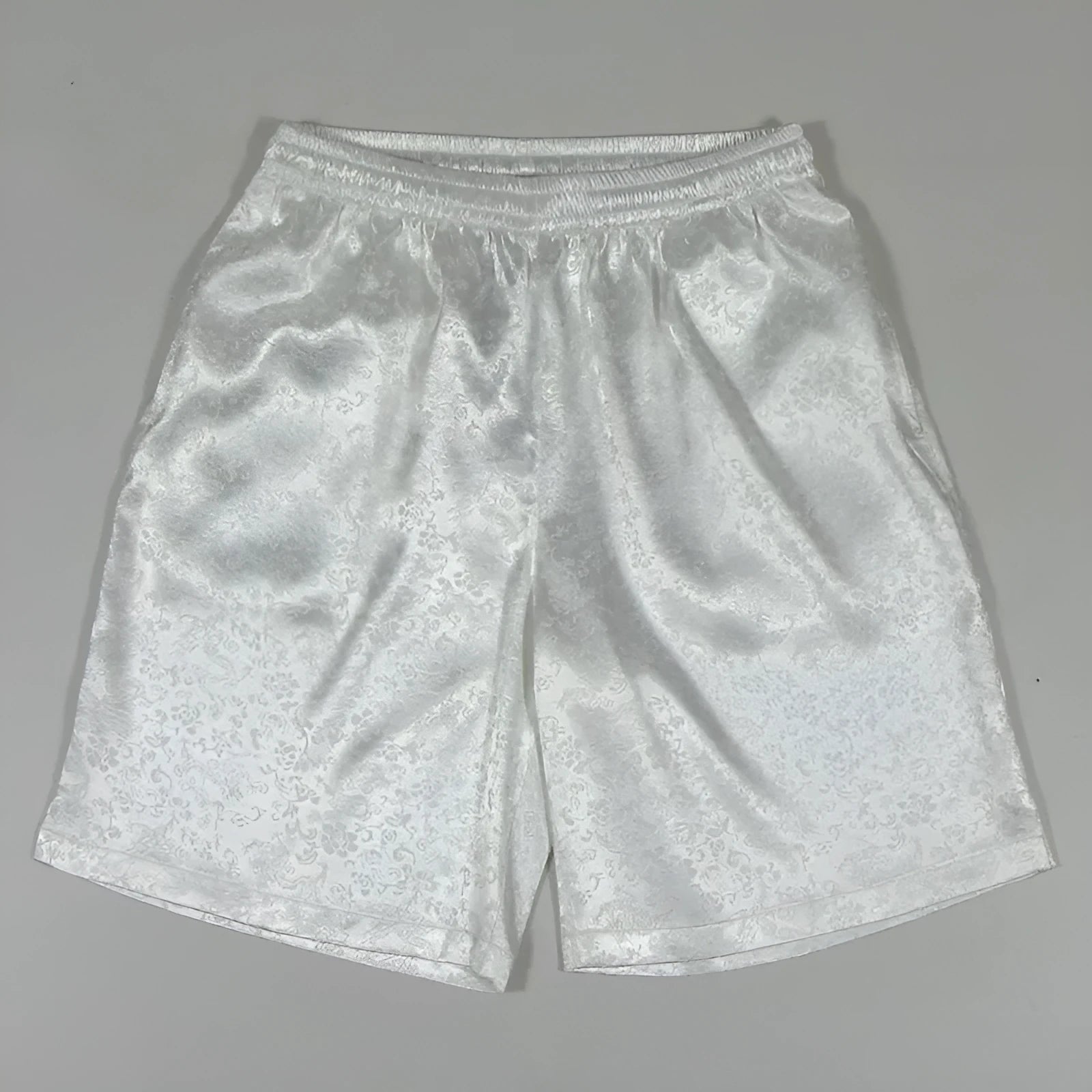 Men's black Tang Suit shorts with an elastic drawstring waistband, shown flat.