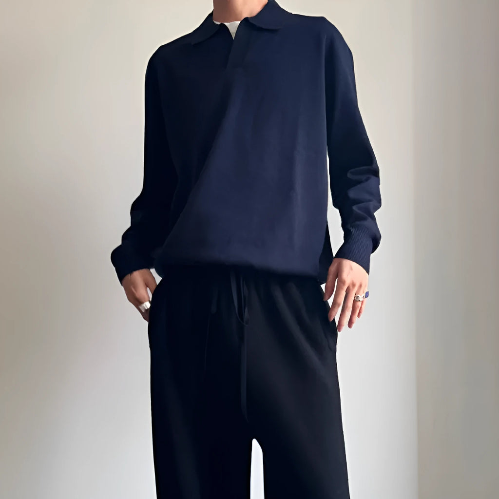Man's pure wool polo sweater with a lapel collar in a loose fit, shown in navy blue.