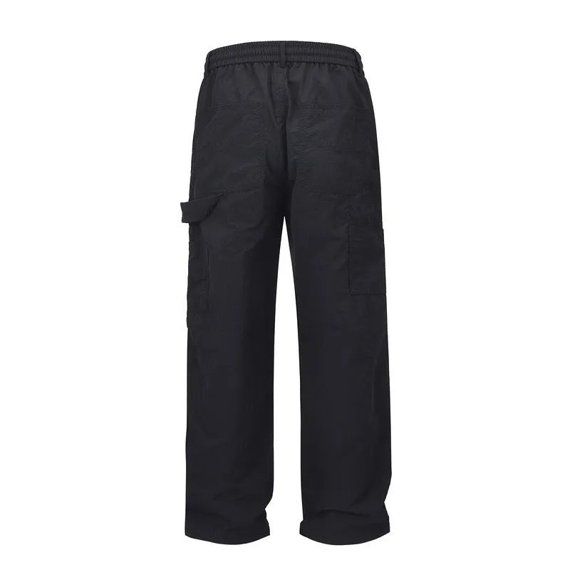 Black paratrooper pants with elastic waist, three-dimensional cutting, and baggy fit