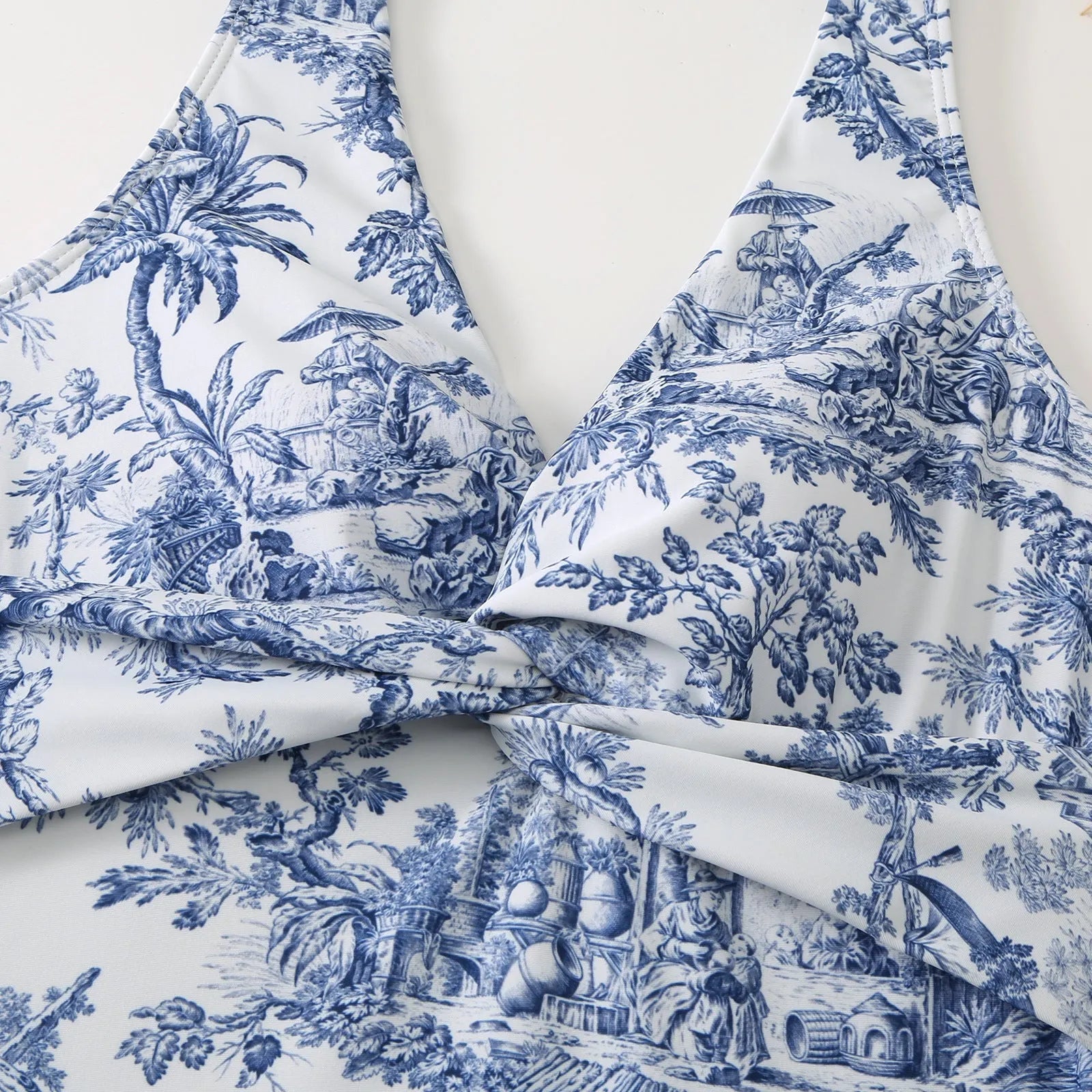 Women's yellow floral vintage print one-piece swimsuit with short sleeves on a mannequin.
