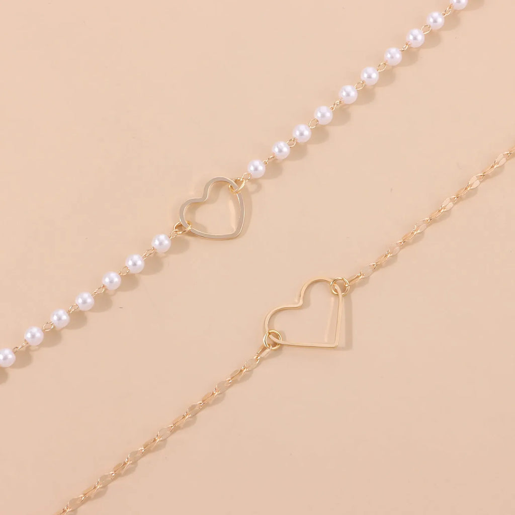 Gold heart-shaped zinc alloy pendant necklace on adjustable chain