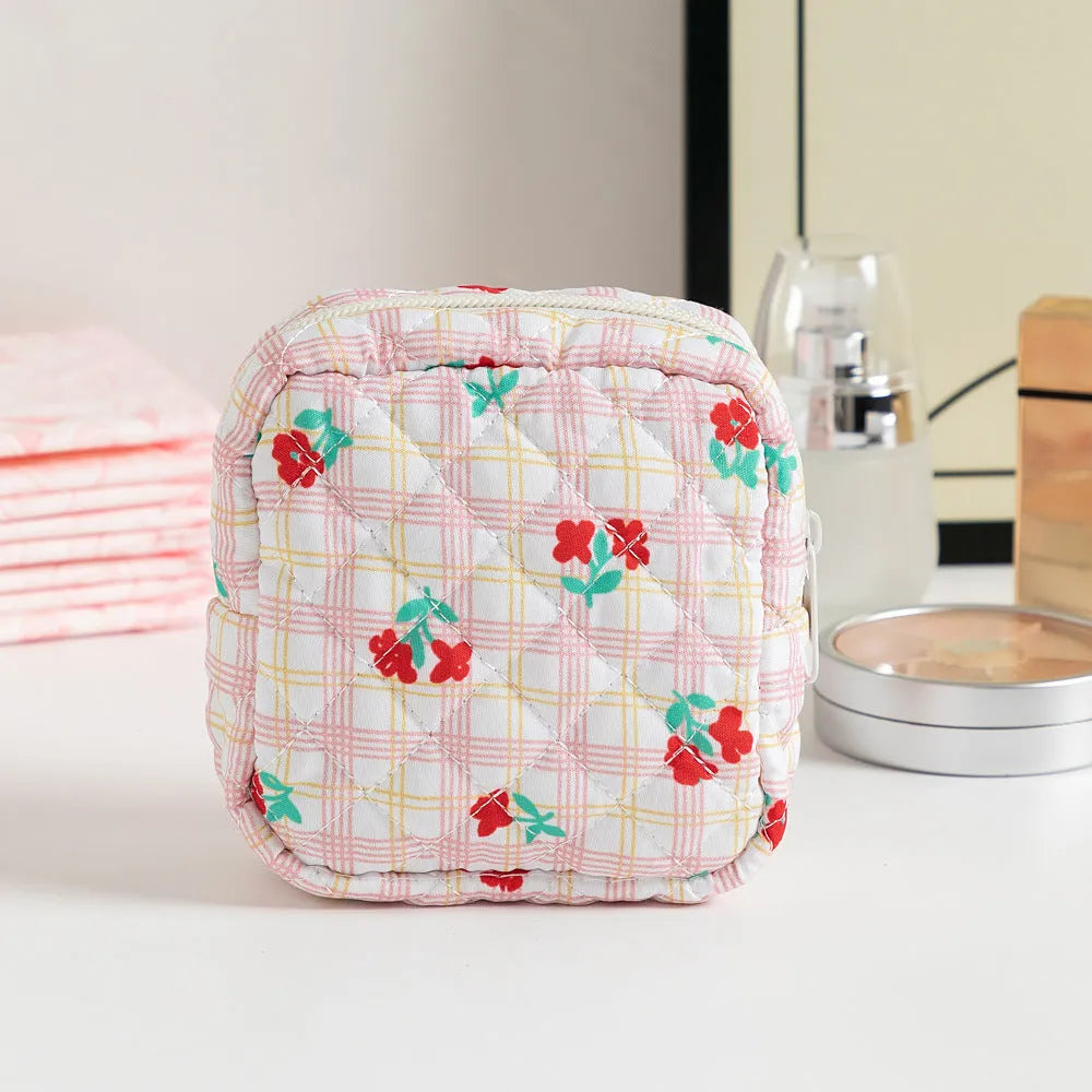 Women's floral patterned polyester key storage bag with sewing thread detail.