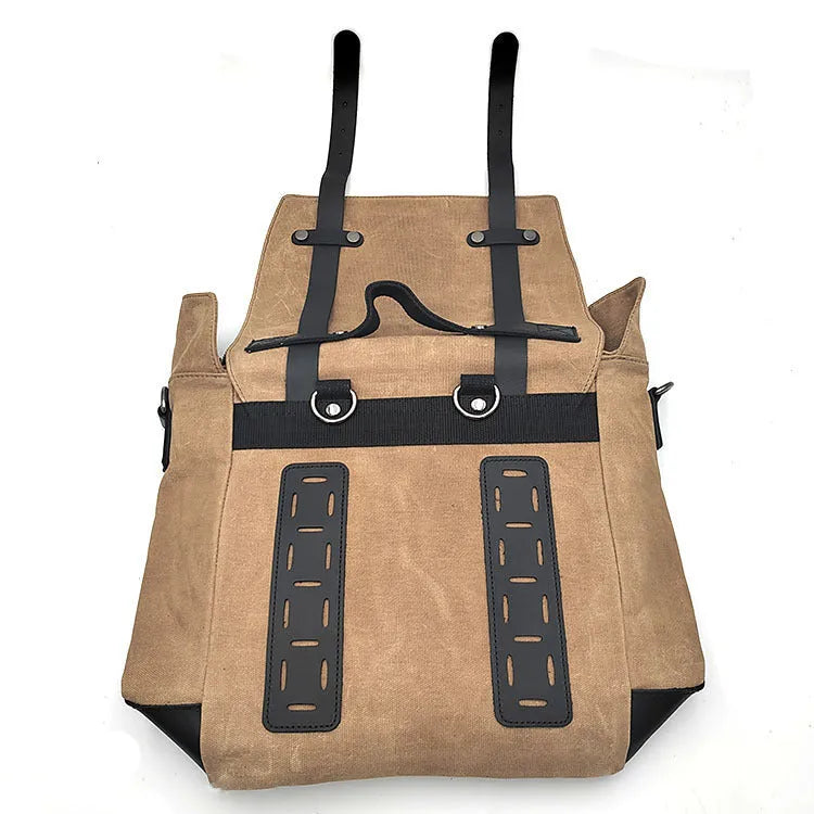 Waterproof canvas motorcycle side pannier bag in black mounted to motorcycle