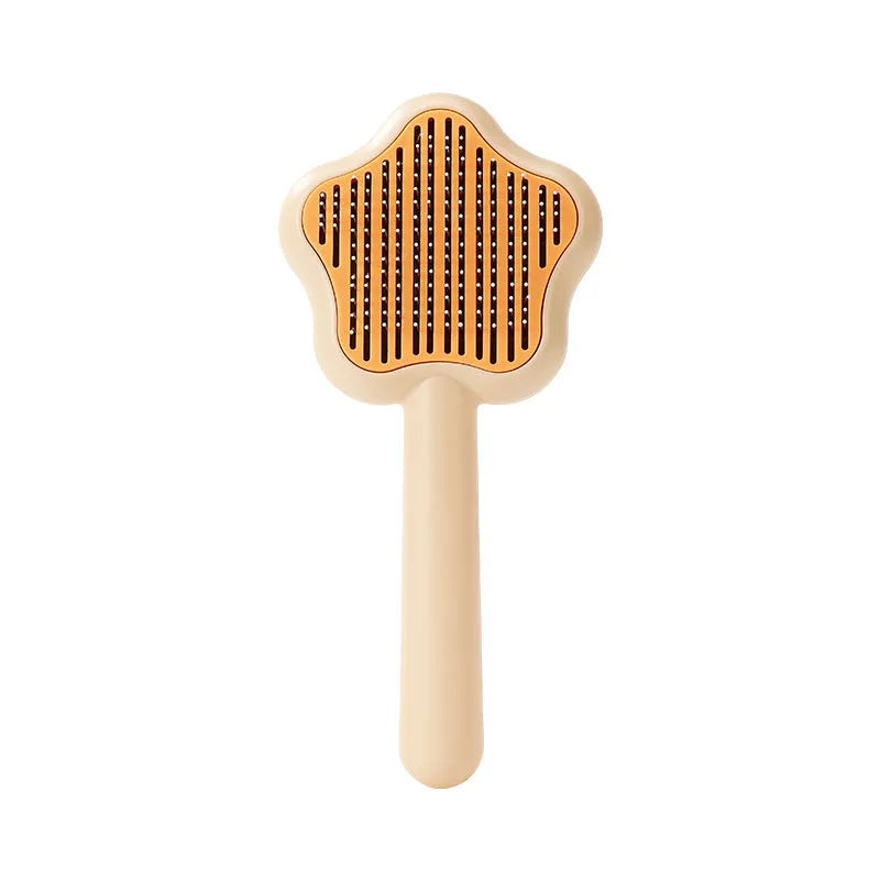 Self-cleaning stainless steel cat comb magic wand measuring 20cm with green or yellow colour options