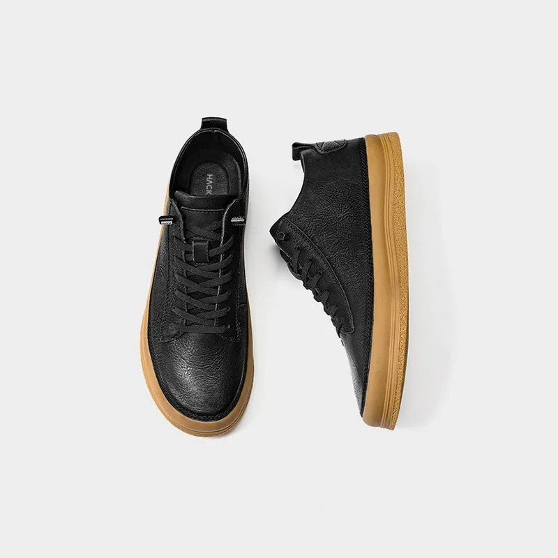 Men's black leather casual shoes with round toe and flat rubber sole, shown with lace-up closure.