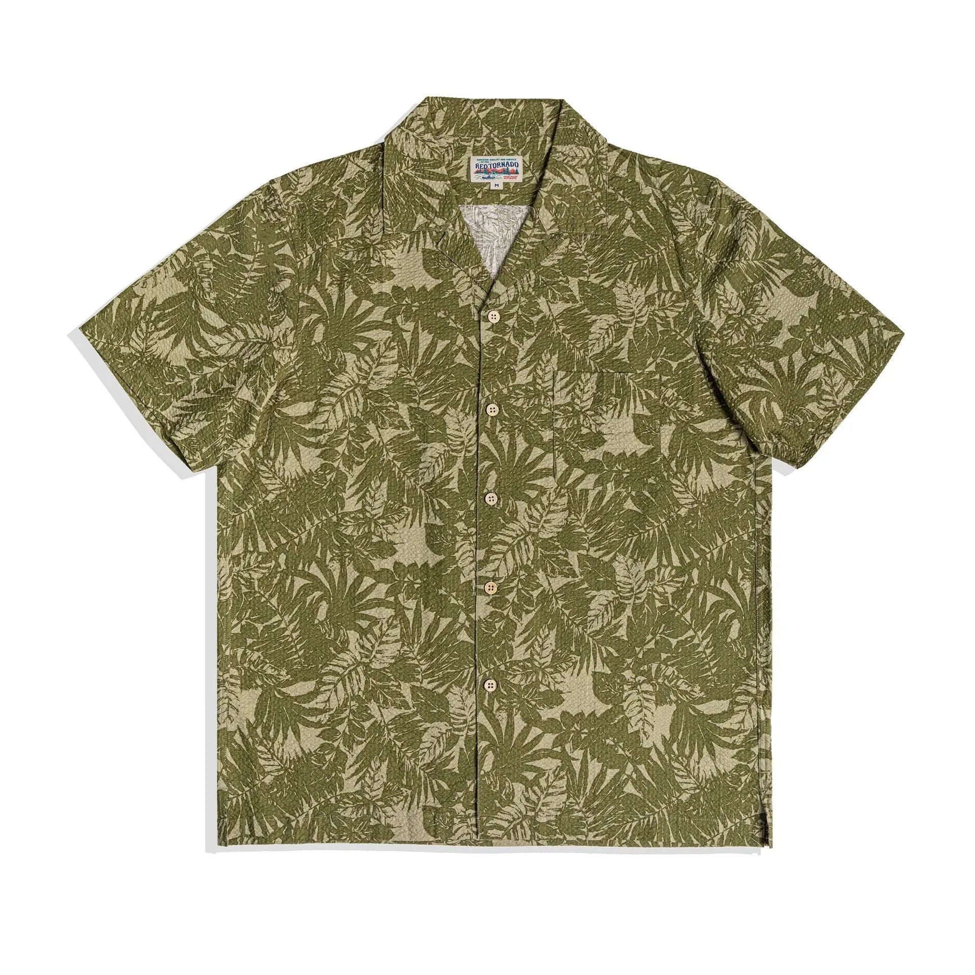 Man wearing a green vintage floral print seersucker shirt with a Cuban collar.