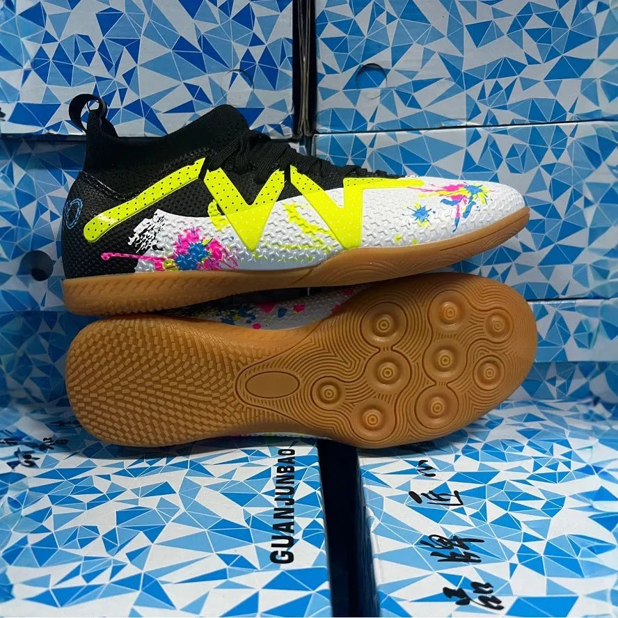 Adult low-top football boots with PVC upper and replaceable studs in black and yellow colourway