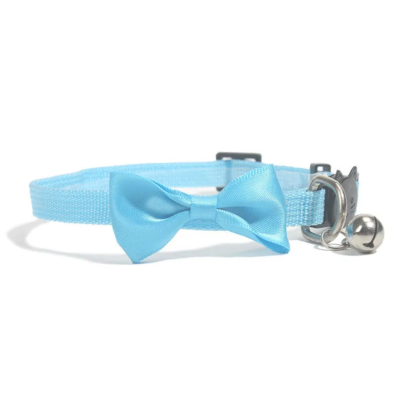 Adjustable striped nylon cat collar with a bell shown in multiple colours including red, blue, green, and pink.