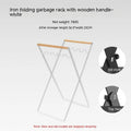 Black folding wrought iron rubbish storage hanger with wooden handle for outdoor use