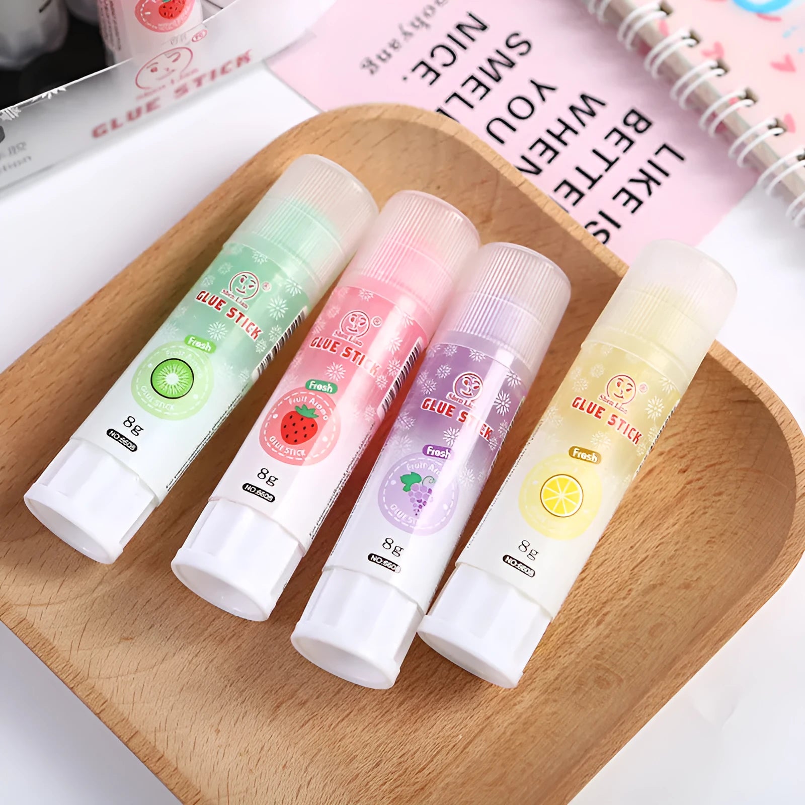 Jelly fruit fragrance solid glue stick 8.5cm long with random colour barrel on white background
