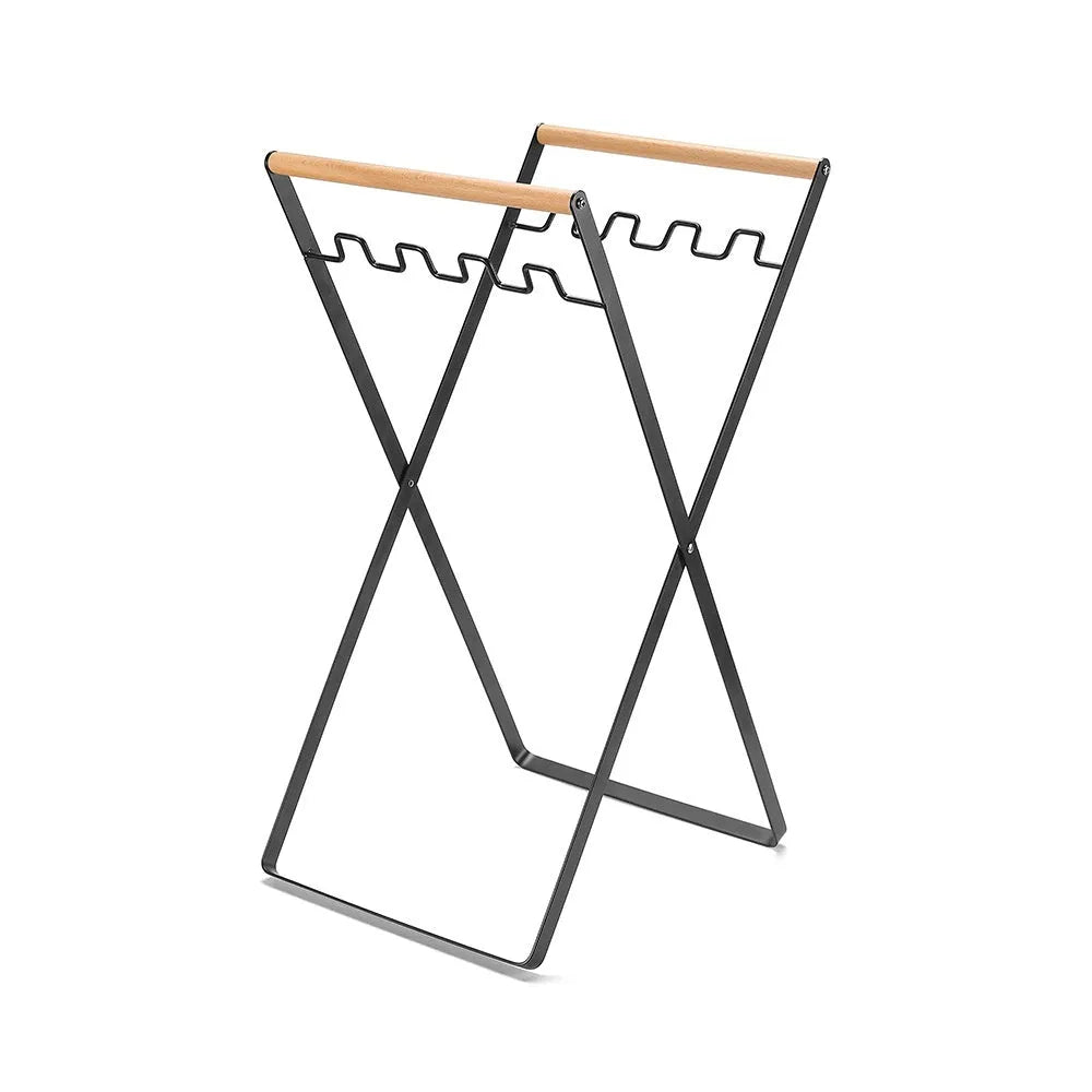 Black folding wrought iron rubbish storage hanger with wooden handle for outdoor use