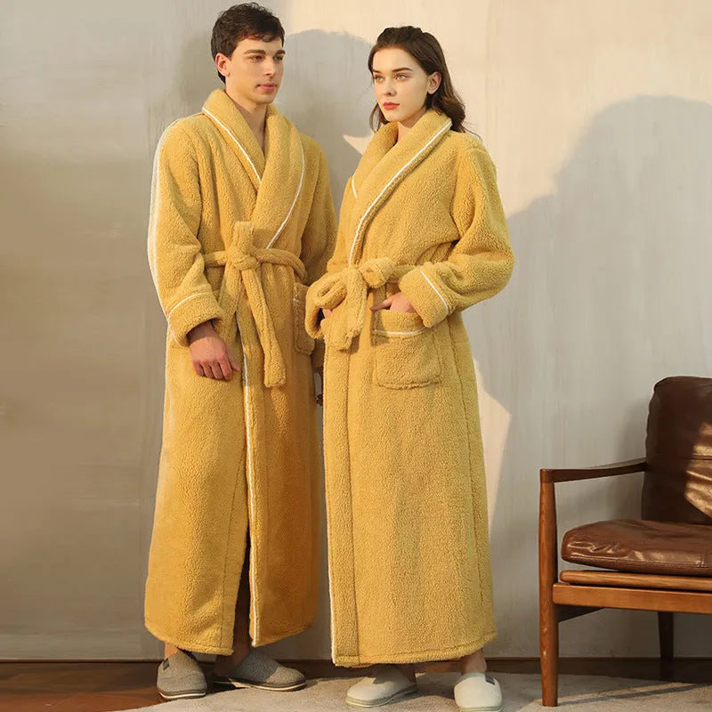 A man and woman wearing matching thickened flannel couple's bathrobes in a winter colour.