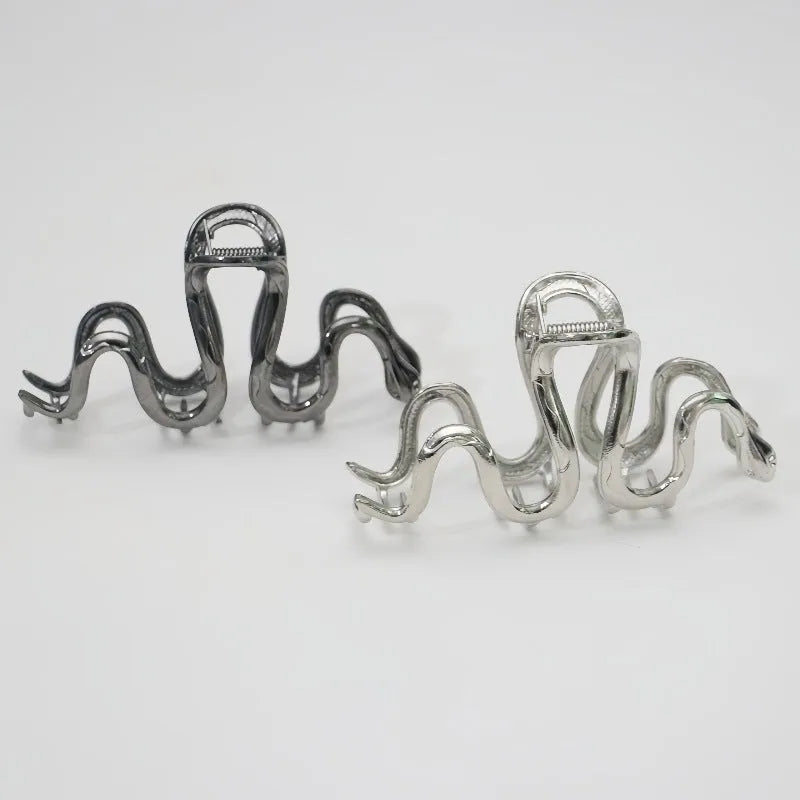 Silver metal hair clip with Slytherin serpentine snake design measuring 10.5 cm