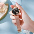 Women's mesh strap watch with rose shell casing showing six face colour options