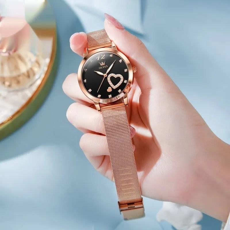 Women's mesh strap watch with rose shell casing showing six face colour options