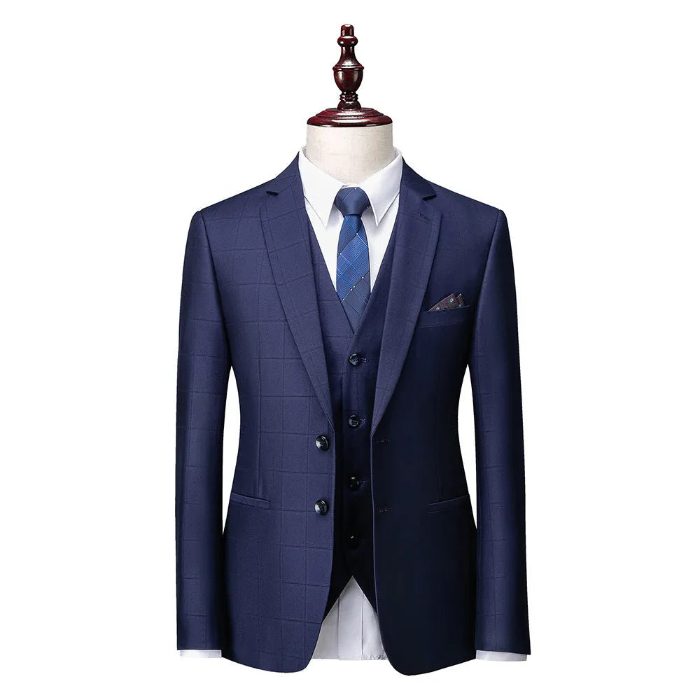 Men's navy blue three-piece slim fit plaid suit with jacket, vest, and trousers on hanger