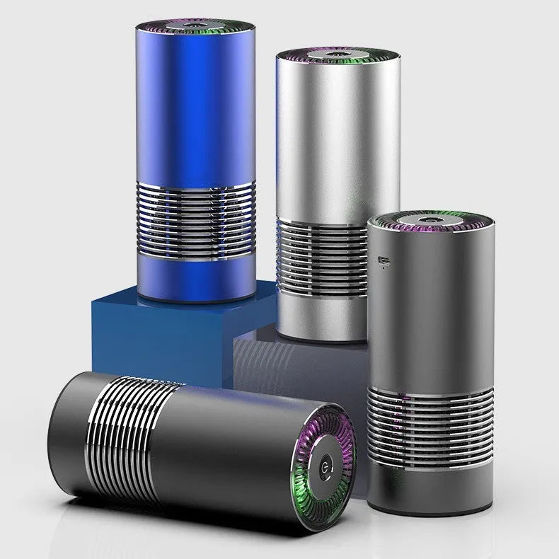 Compact wireless car air purifier in aluminium alloy and ABS, shown in black, silver, and metallic grey.