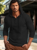 A cotton pullover hoodie for youth in dark blue, shown in a casual setting.