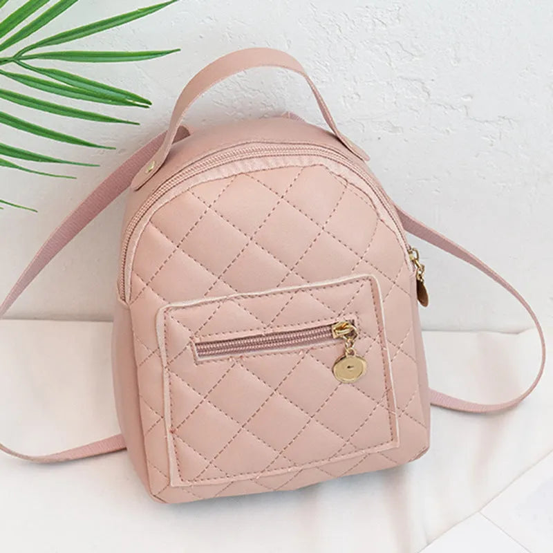 Girls' hard case Korean-style embroidered backpack in pink showing vertical square shape and soft carry handle.