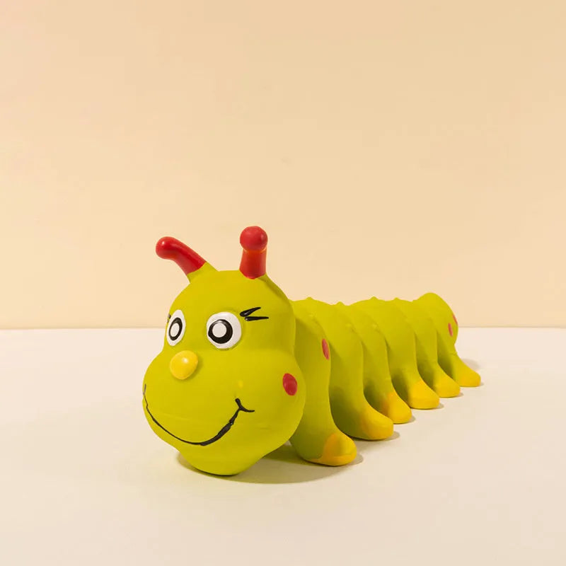 Yellow rubber caterpillar-shaped squeaky toy for dogs, shown next to a tape measure indicating 25.5cm length.