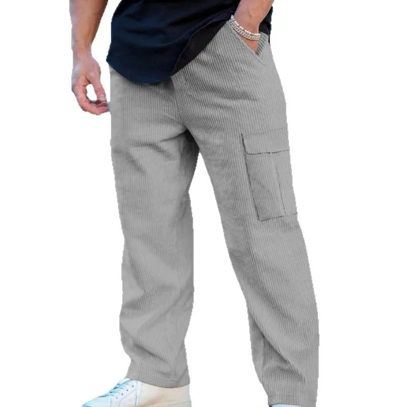 Men's loose-fitting corduroy cargo trousers in navy blue with straight wide-leg cut and elasticated waist