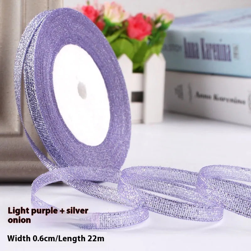 Roll of 0.6cm wide coloured polyester gift ribbon with 22 metre length.