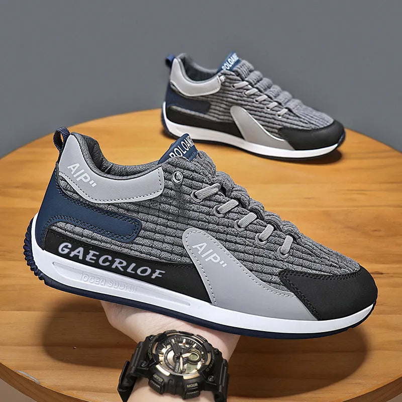 Men's green and grey low-top mesh running shoes with round toe and lace-up front.