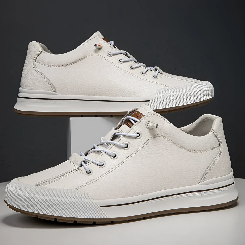 Men's white matte leather casual shoes with breathable hollow-out design and flat heel.