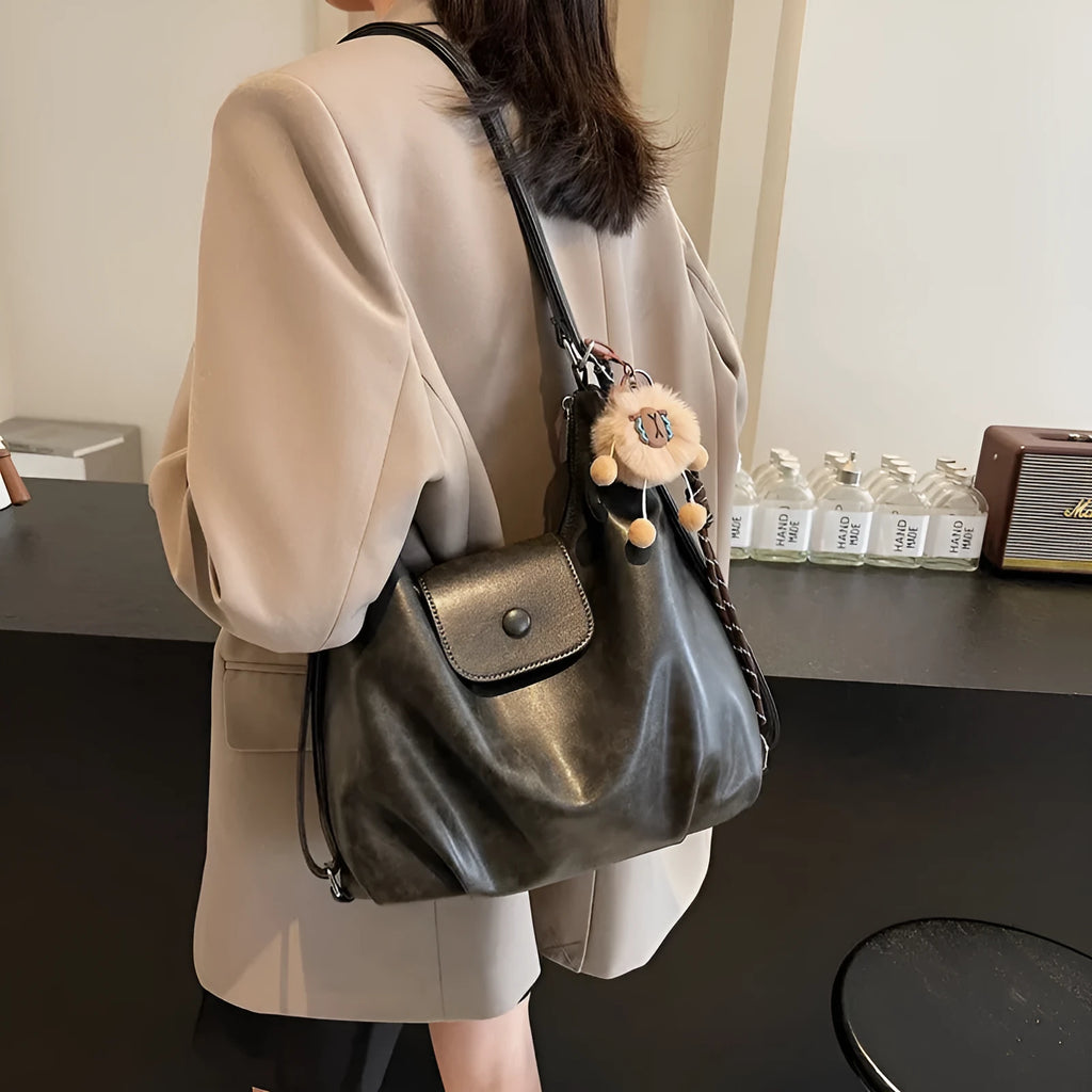 Women's PU leather shoulder bag in horizontal square shape with single strap, showing interior mobile phone compartment