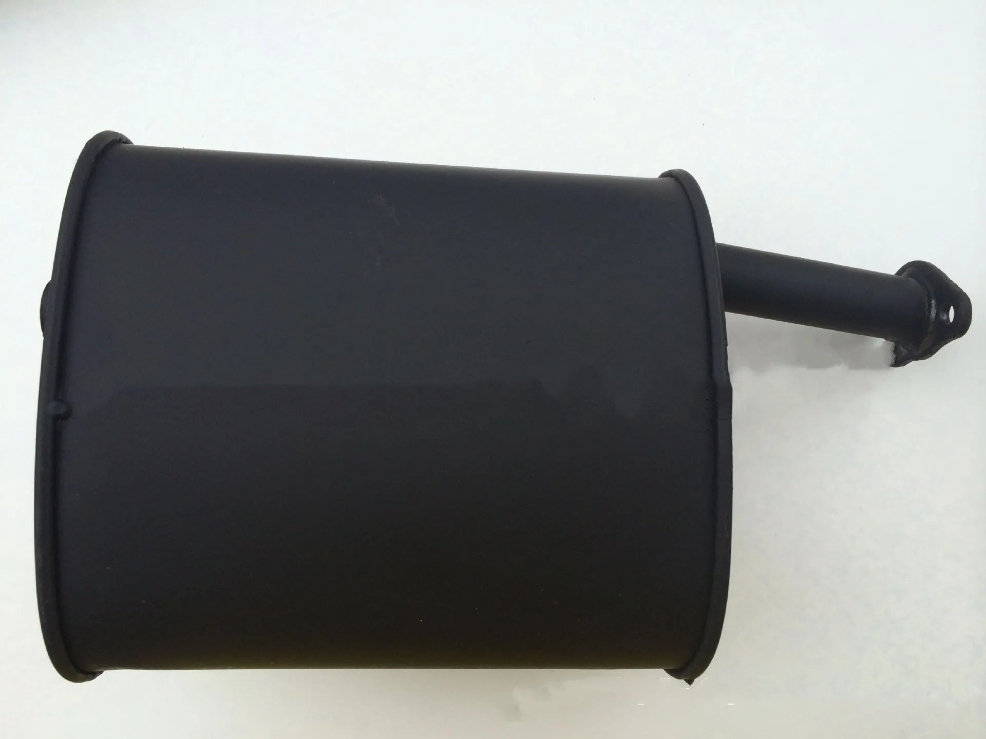 Generator exhaust silencer and chimney pipe accessory for portable gasoline power generators.