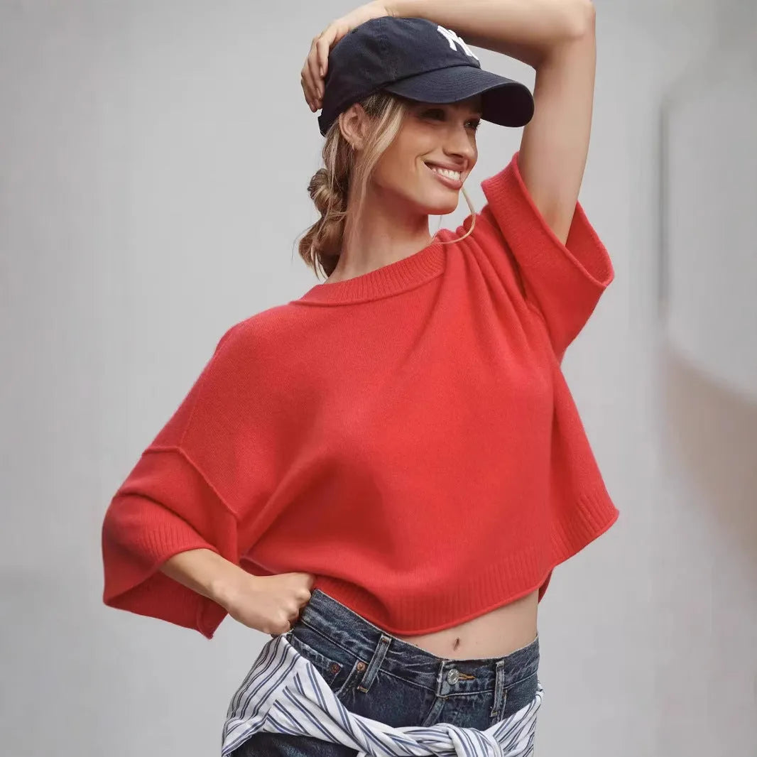 Red short sleeve viscose T-shirt with an exposed navel crop design on a model.