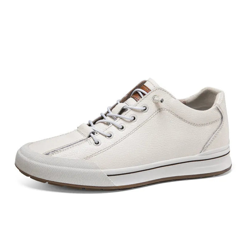 Men's white matte leather casual shoes with breathable hollow-out design and flat heel.