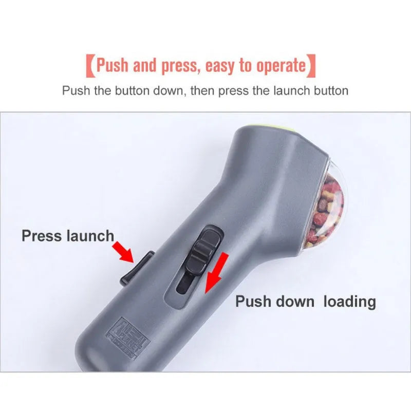Grey pet snack catapult launcher for dogs and cats on a neutral background.